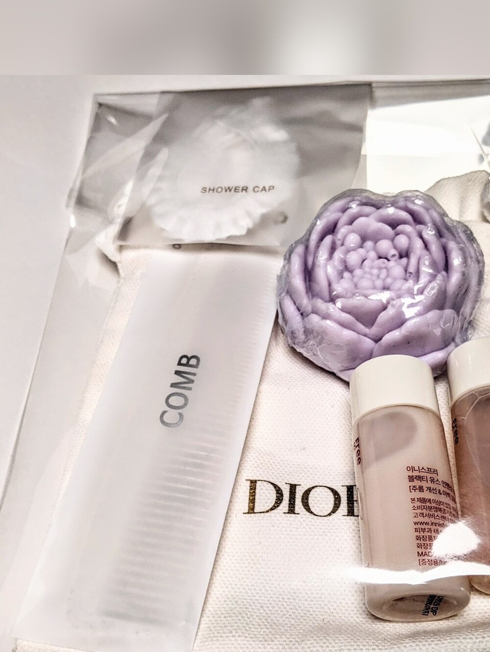 Nwot Dior White Pouch with travel set skincare + comb, cap Innis free & no Brand